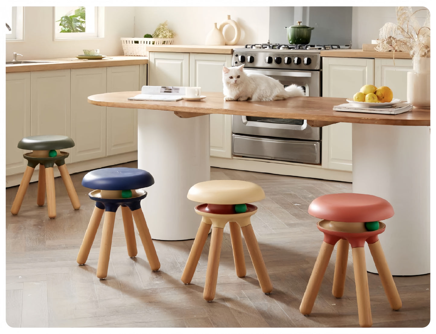 Colorful stools in a kitchen setting with a white cat on a counter.