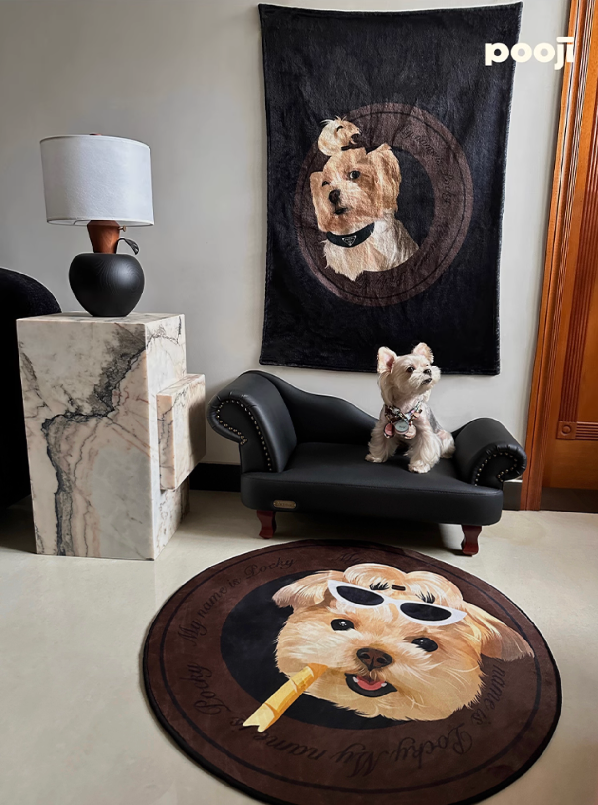 Dog-themed rug and tapestry in a room with a dog sitting on a chair.