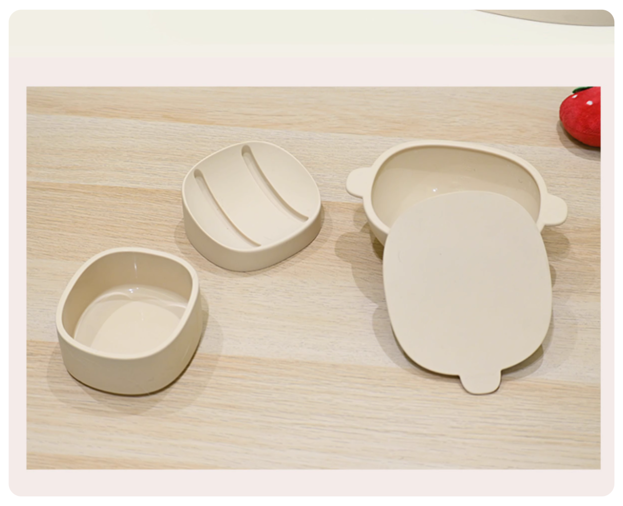 Set of three beige silicone molds on a wooden surface