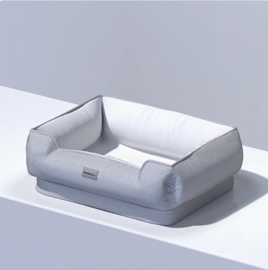 Gray inflatable air bed on a light gray background