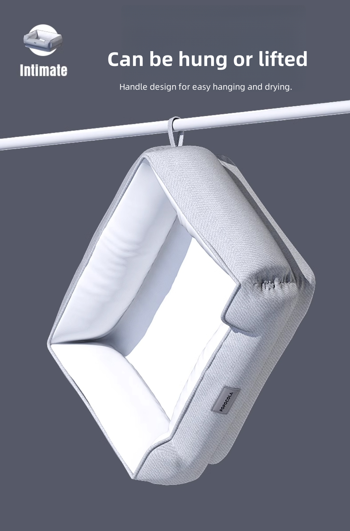 White laundry basket hanging on a line with text indicating it can be hung or lifted.